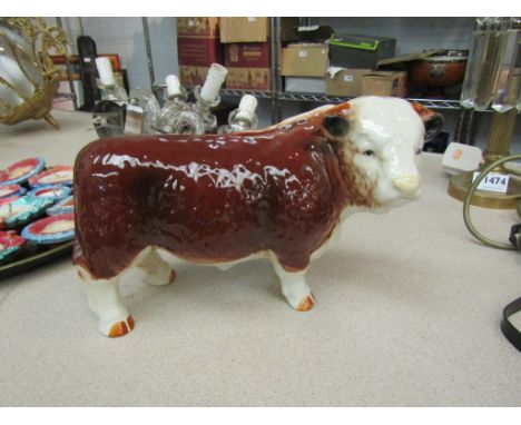 A ceramic figure of a bull, 16cm x 26cm
