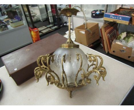 A French 1920's globular hanging light with multiple gilt floral decoration