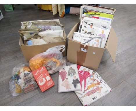 A box of sewing patterns including "Vogue" and "Simplicity" etc dress making threads, project books, tapestry fabrics etc