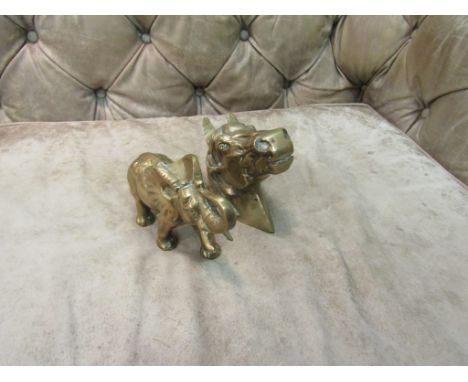 Two brass figures of an elephant and horses head 
