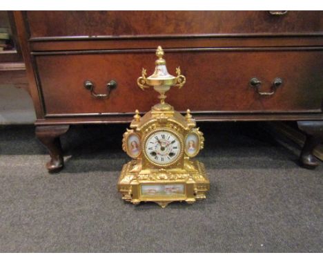 A late 19th Century French ormolu mantel clock with Japy Frere movement, hand-painted decorative porcelain panels, 36cm tall