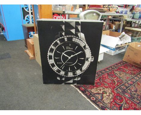An advertising light box with Dior Automatic Wristwatch to front              