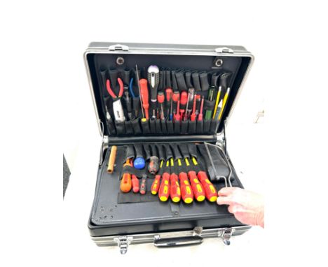 Large black case with an assortment of tools 
