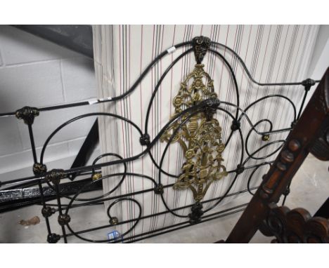 A Victorian style cast iron four poster double bed frame and base