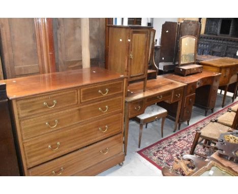 An Edwardian mahogany part bedroom suit comprising dressing table, pot cupboard, and chest of two over three drawers and simi