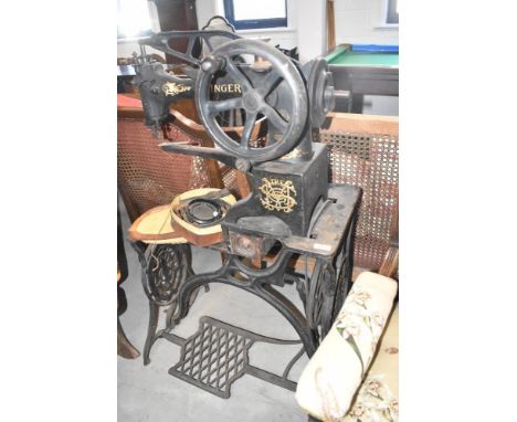 A Victorian saddlers treadle/hand crank sewing machine by Singer, no guarantees but seems to move freely