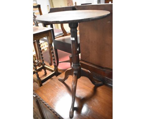 A 19th Century oak pedestal occasional table having circular top with turned column and triple splay legs, diameter approx. 4
