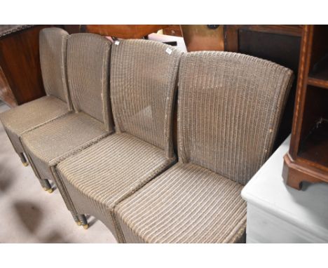 A set of four Lloyd Loom style garden or conservatory chairs, labelled Vincent Shepherd