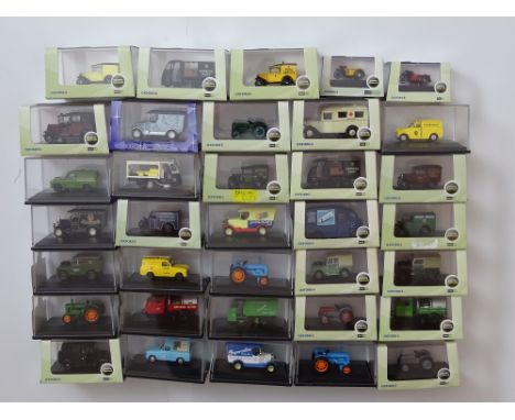 GENERAL DIECAST: A quantity of 1:76 scale commercial vans and tractors by OXFORD DIECAST - appear unused - VG/E in G/VG boxes