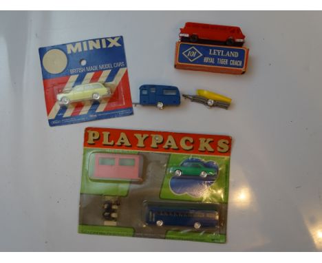 VINTAGE TOYS: A group of TRI-ANG MINIX to include a sealed car, an unboxed caravan and boat trailer and a rare complete seale