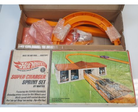 GENERAL DIECAST: A HOT WHEELS REDLINE Super Charger sprint set - complete with one car - contents G/VG in F box with replacem