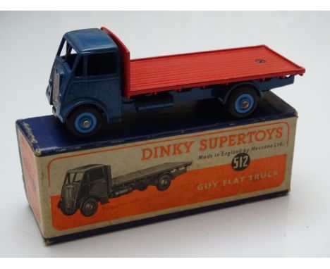 DINKY: A 512 Guy Flat truck in blue with mid blue hubs and red back - G/VG in G box
