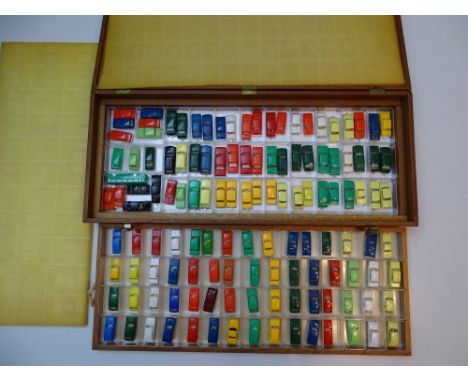 VINTAGE TOYS: A large fitted wooden case containing 128 TRI-ANG MINIX cars and a coach - as lotted - G/VG (129 plus case)