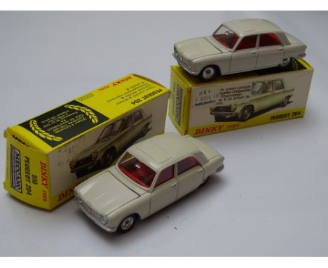 DINKY: A pair of French DINKY 510 Peugeot 204 both in beige with red interiors - issues made in Spain - VG in G boxes (2)