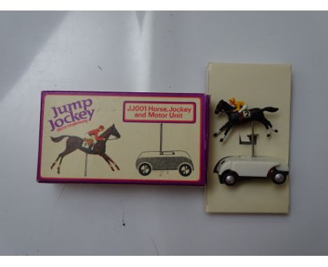 VINTAGE TOYS: A TRI-ANG rare jump jockey JJ001 spare horse, jockey and motor unit for the electric steeplechasing system - VG