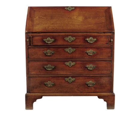 An early George III mahogany bureau, the interior fitted with an arrangement of pigeon holes and drawers above four long grad