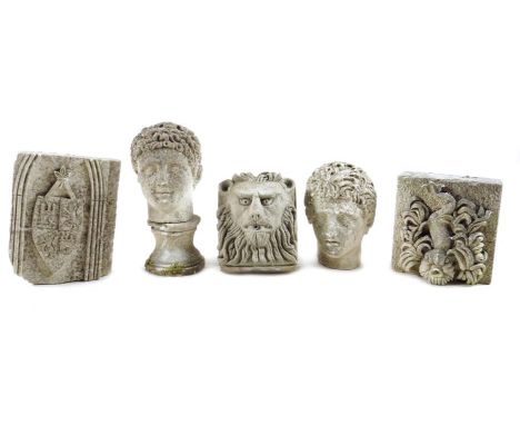 Five stone carvings, comprising: a lion's mask plaque, two Roman style portrait busts, one on a socle, a plaque of a sea mons