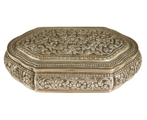 A late 19th century Indian silver trinket box, embossed with scrolling flowers and foliage, 12.8cm wide.Provenance: The Dr La