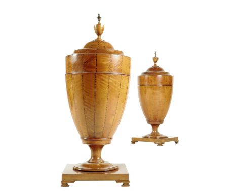 A pair of 19th century satinwood cutlery urns, each with a brass and turned vase finial and inlaid with chequer and feather s