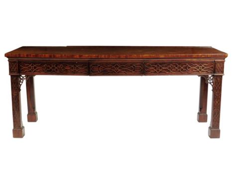 A 19th century mahogany serving table, the rectangular plum pudding top above a dentil and blind-fret frieze in the Chinese C