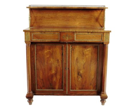 λ A Regency rosewood and brass mounted side cabinet, inlaid with brass marquetry, the raised back with a three quarter galler