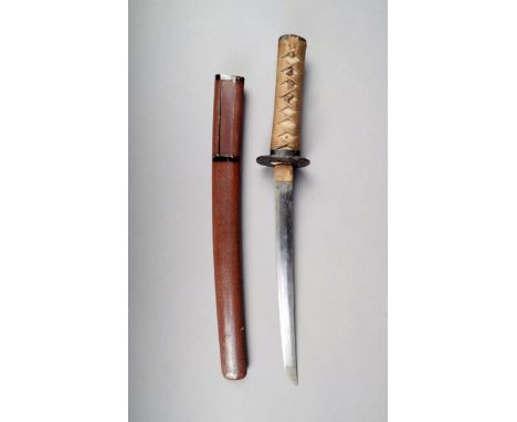 A Japanese tanto, the 32cm long blade, unsigned, with a bound sharkskin handle, cast iron tsuba, marked with a character, wit