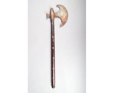 An early 19th century Indian fighting axe, with pierced crescent blade and silver rosettes on hardwood grips, 65.5cm long.Pro