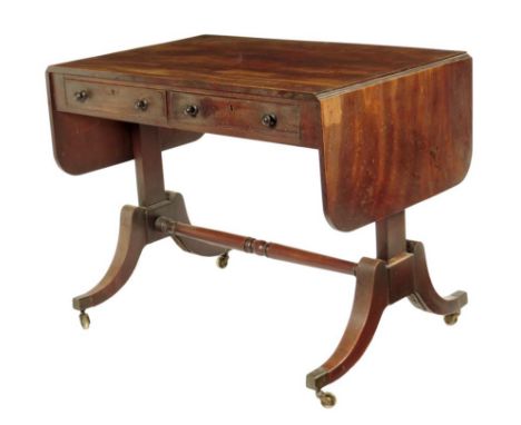 A William IV mahogany sofa table, the solid top above a pair of frieze drawers, the reverse with false fronts, with a turned 