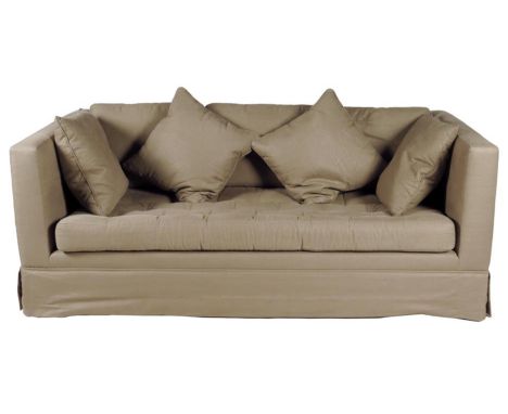 A 'Trieste' sofa design by Paolo Moschino for Nicholas Haslam, covered in Brittany glazed linen with a buttoned seat and four