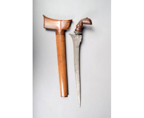 A Malayan kris, with an etched 35.5cm long blade and a wood handle carved a stylized bird head, in a wood scabbard.
