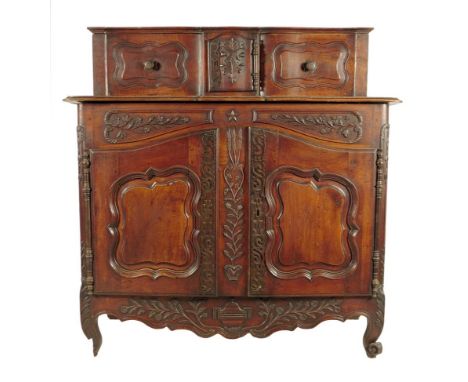 A late 18th century French Provence walnut buffet a glissant, the raised top with a pair of panelled sliding doors flanking a