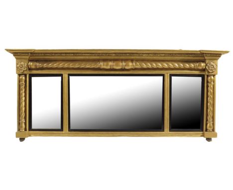 A William IV giltwood landscape overmantel mirror, with three rectangular plates with ebonized reeded slips to a spiral twist
