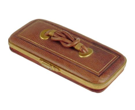 A 19th century French leather and brass mounted Palais Royal étui, with a strap handle, the silk and plush lined interior fit