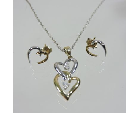 A 9 carat gold and white gold heart shaped necklace, on a silver chain, together with a pair of earrings, boxed