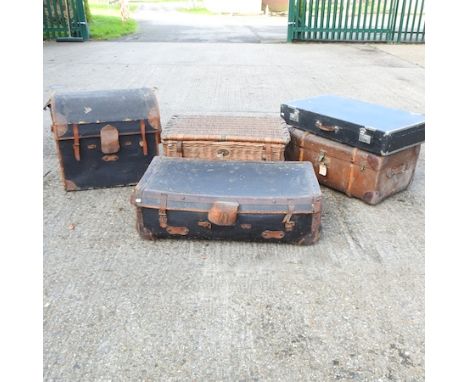 An early 20th century black dome top trunk, 63cm, together with a wicker basket, two trunks and a case (5)