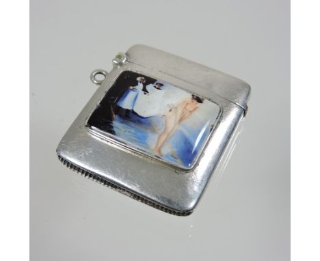 A silver and enamel vesta, painted with a nude figure, 4cm
