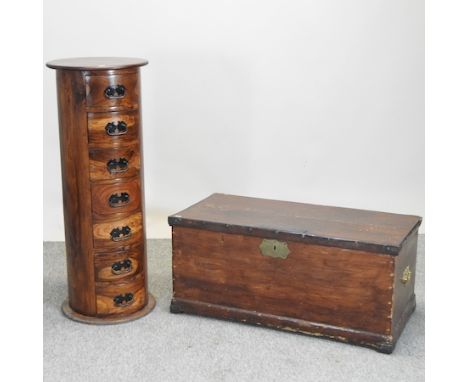 A stained pine trunk, 93cm, together with a hardwood cylindrical chest of drawers