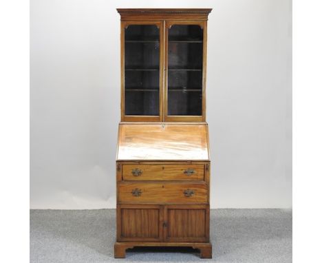 An Edwardian mahogany glazed bureau bookcase, on bracket feet, 71cm