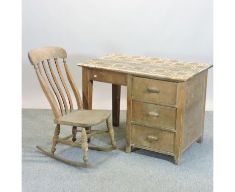 A 1930's light oak desk, 106cm, together with a 19th century rocking chair