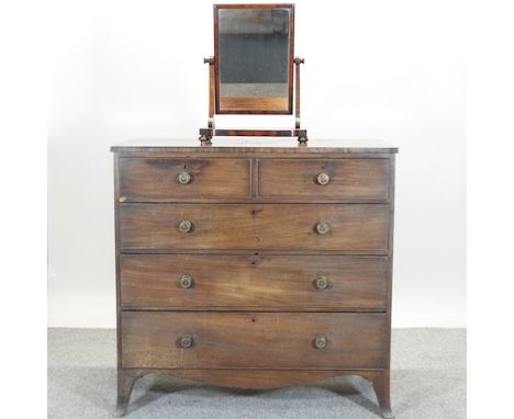 A George III mahogany chest of drawers, on swept bracket feet, 109cm, together with a mahogany toiletry mirror