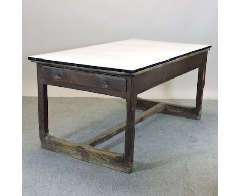A 19th century kitchen table, with a later white enamel top, 168 x 90cm