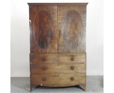 A George III mahogany linen press, on swept bracket feet, 126cm