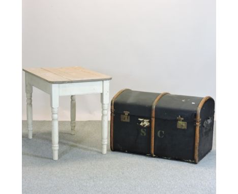 A canvas and wood bound dome top trunk, 87cm, together with a pine kitchen table