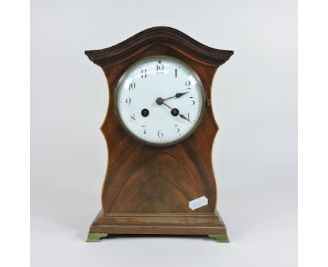 An Edwardian mantel clock with an enamel dial, 27cm high