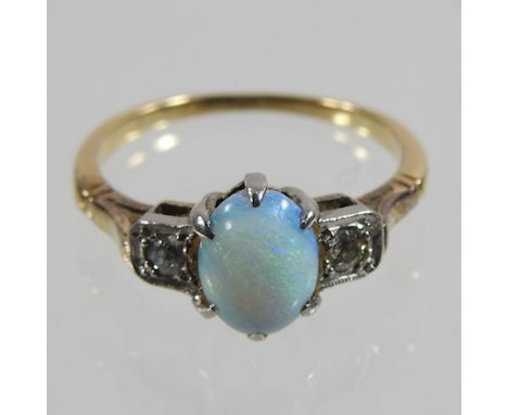 An 18 carat gold opal and diamond cluster ring, boxed