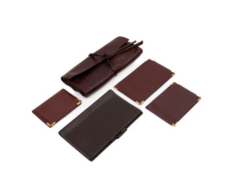 A GROUP OF CARTIER, HERMES AND OTHER LEATHER ACCESSORIES
Comprising: an Hermes notebook or diary holder; a Must de Cartier mo