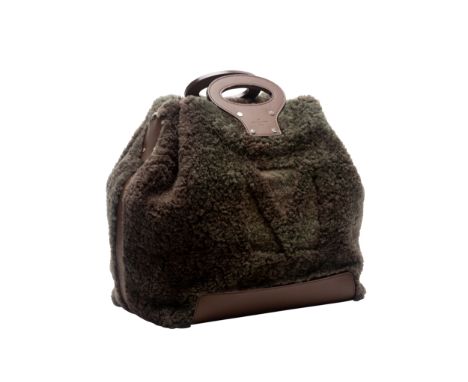 A LOUIS VUITTON SHEARLING TOTE -MENS FALL/WINTER 2013 RUNWAY Fall/Winter 2013 Collection, shearling with cut out logo to one 