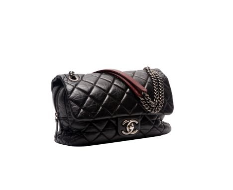 A CHANEL BLACK LEATHER PORTOBELLO CLASSIC FLAP BAG
With ruthenium hardware, quilted black leather, single flap and zip closur