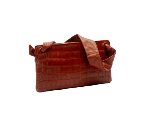 A BOTTEGA VENETA SHOULDER BAG
Crocodile embossed brwon leather,  brown suede interior with pocket mirror, sold with brand dus