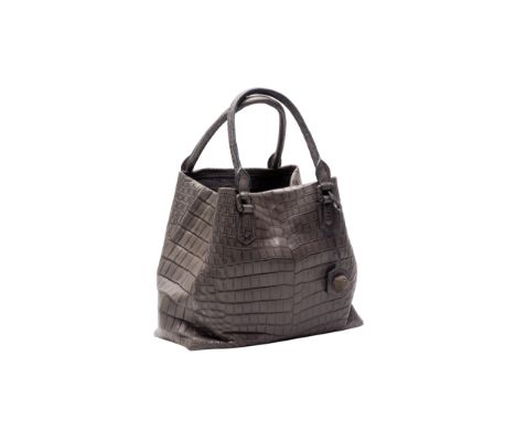 AN ETHAN K MATTE CROCODILE TOTE
Grey, with blue interior, magnetic or popper closure, leather and cast metal hedgehog charm, 
